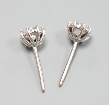 A pair of 750 white metal and solitaire diamond set ear studs